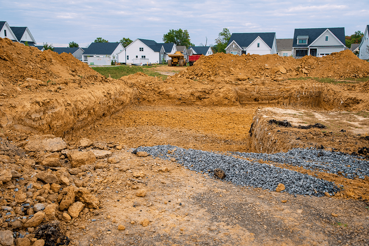Loose dirt and gravel at a home construction site.