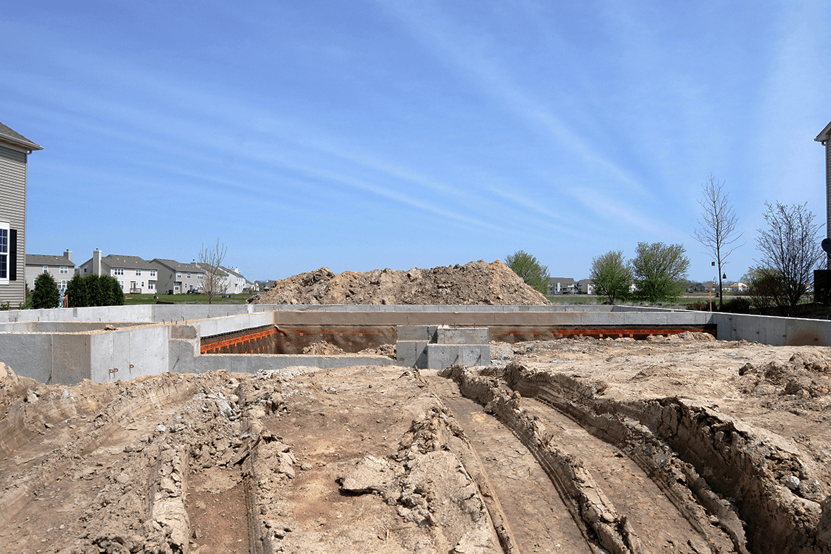 Brick foundation laying at a construction site